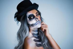 Spooky portrait of woman in halloween gotic makeup photo