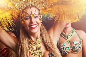 Brazilian women dancing samba at carnival photo