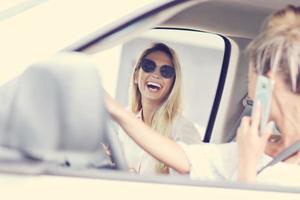 Woman talking on phone while driving photo