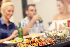 Group of friends having barbecue party photo