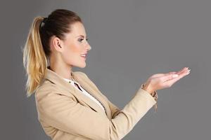 Businesswoman presenting something photo