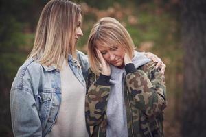 Lgbt couple or girl friends in wood having bad time photo