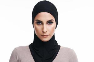 Muslim woman over white background photo