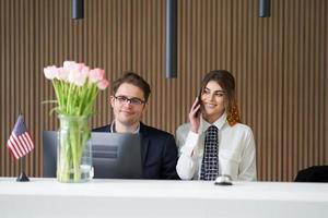 Receptionist working in a hotel photo