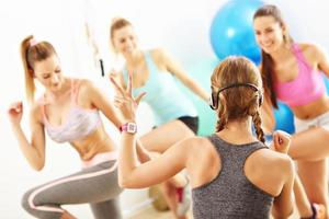 Group of smiling people doing aerobics photo