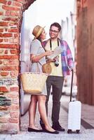 Adult happy tourists sightseeing Gdansk Poland in summer photo