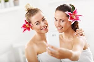 Two beautiful women in spa photo