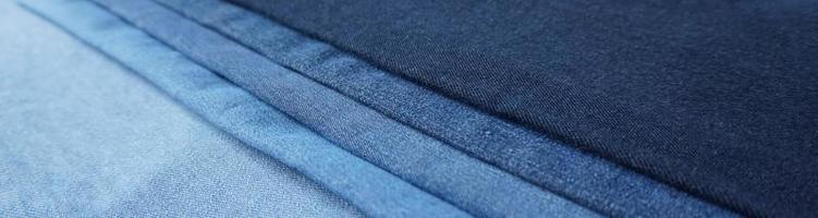 Denim fabric light to dark different shades abstract background photo