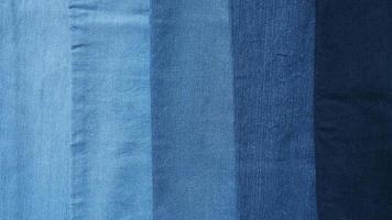 Denim fabric light to dark different shades abstract background photo