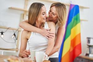 LGBT Lesbian couple love moments in the kitchen happiness concept photo