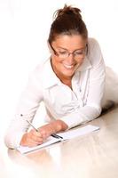 A young woman writing photo