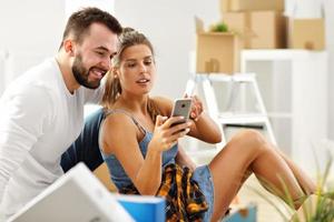 Happy adult couple moving out or in to new home photo