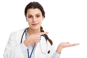 Woman doctor isolated over white background photo