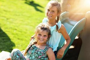 Joyful children having fun on playground photo