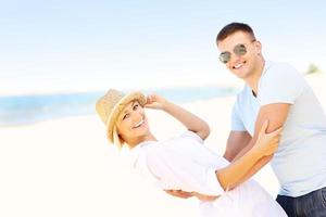 Joyful couple at the beach photo