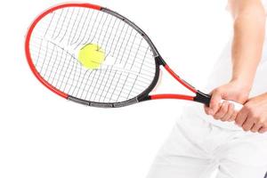 Tennis racket with broken strings photo