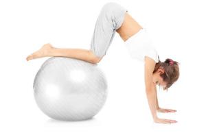 Woman exercising with a ball photo