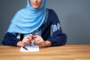 Muslim female student learning at home photo