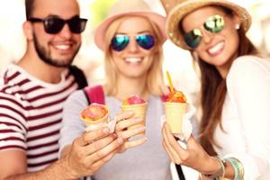 Group of friends eating ice-cream photo