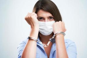 Attractive woman wearing protective mask isolated over white background photo