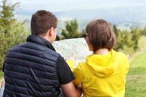Young couple with map photo