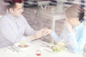 Engagement in a restaurant photo