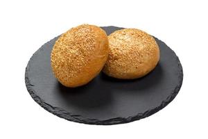 butter bread roll on a plate on white background photo