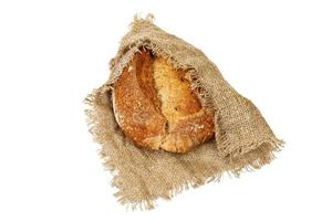 Appetizing black bread, on coarse cloth from sackcloth photo