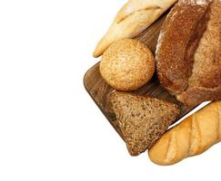 fresh baked bun and bread on cutting board isolated on white photo