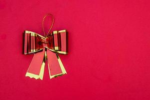 ribbon bow on red background , geeting card and copy space photo