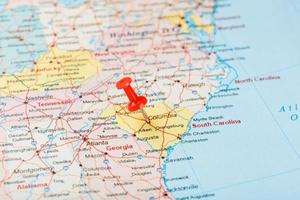 Red clerical needle on a map of USA, South South Carolina and the capital Columbia. Close up map of South South Carolina with red tack, United States map pin photo