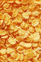 Golden cornflakes background and texture. View from above. cornflakes healthy breakfast. Close-up. macro photo