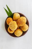 onde-onde or sesame ball or Jian Dui is fried Chinese pastry made from glutinous rice flour and coated with sesame seeds filled with bean paste. isolated on white background photo