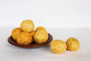 onde-onde or sesame ball or Jian Dui is fried Chinese pastry made from glutinous rice flour and coated with sesame seeds filled with bean paste. isolated on white background photo