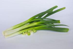 raw organic leek and leek slice isolated on white background photo