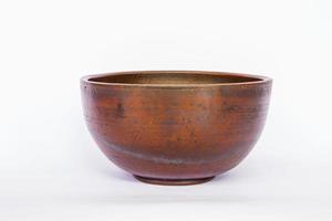earthenware bowl isolated on white background. earthenware crafts photo