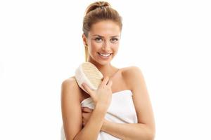 Woman with bath sponge isolated on white with healthy skin photo