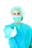 Surgeon In Scrubs Showing Thumbs Up Sign photo