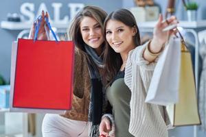 Group of happy friends during shopping photo