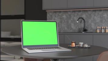 laptop met blanco groen scherm, staand Aan tafel Bij huis. computer bespotten omhoog met chroma sleutel. kopiëren ruimte voor video, app, spel, website presentatie. leeg laptop scherm. modern interieur. 3d animatie. video