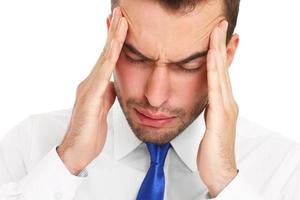 Businessman suffering from headache photo