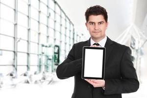 Businessman holding a tablet device with copy space photo