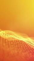 Wave particles background Abstract Yellow dots wave form polygonal three dimension space. Vertical looped video