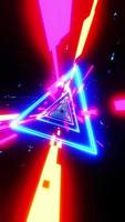 Flying through an abstract tunnel with neon triangles. Vertical looped video