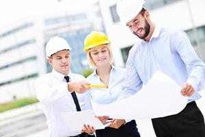 Group of young architects on site photo