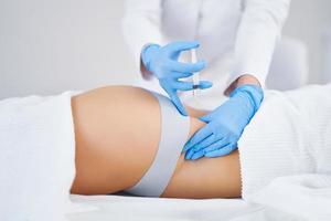 Picture of lipolysis treatment on different parts of woman body photo