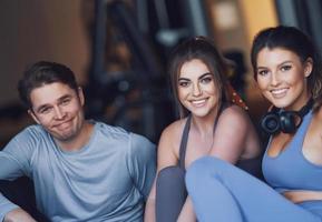 Group of people working out in a gym photo