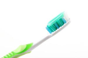 Tooth brush with tooth paste close-up photo
