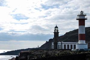 Lighthouse by the ocean photo