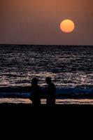 Sunset over the ocean photo